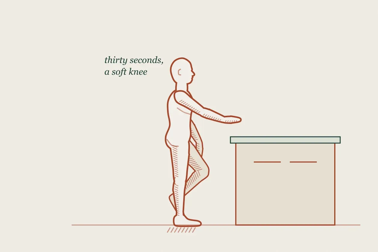 Exercise drawing: a figure balancing on one leg beside a kitchen counter